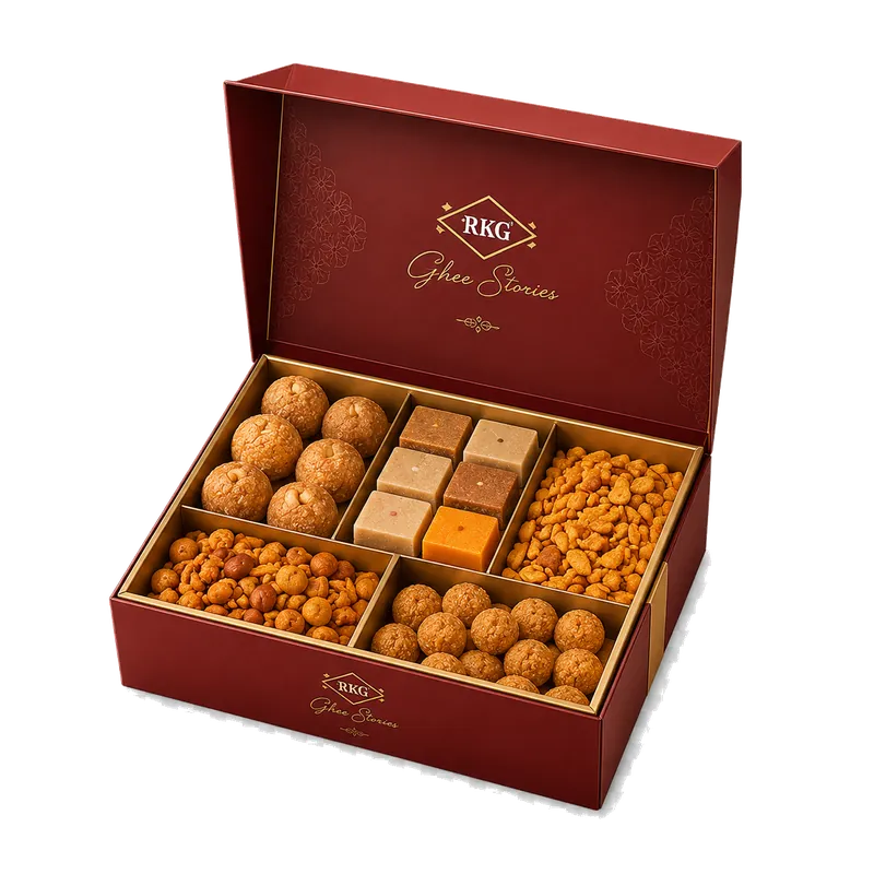 Open box showing four compartments of sweets and snacks